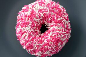 doughnut with white and pink sprinkles